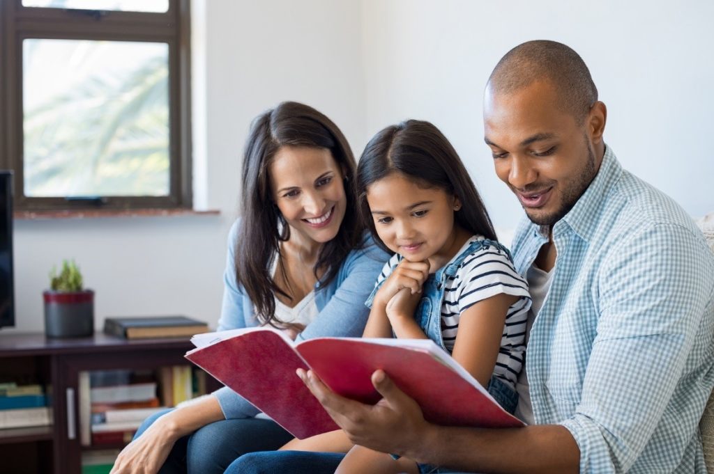 parents reading to a child