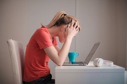 woman stressed using a computer